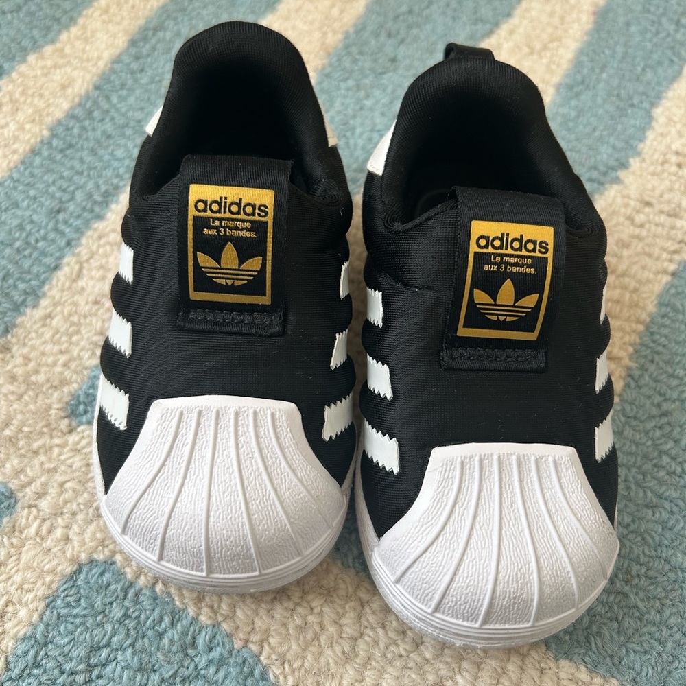 Adidas Kids Black and White Sneakers with Gold Accents